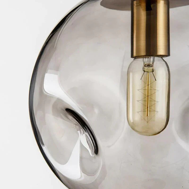 Závěsná skleněná lampa Aeris pro minimalistické stropní svítidla v moderních obytných prostorách